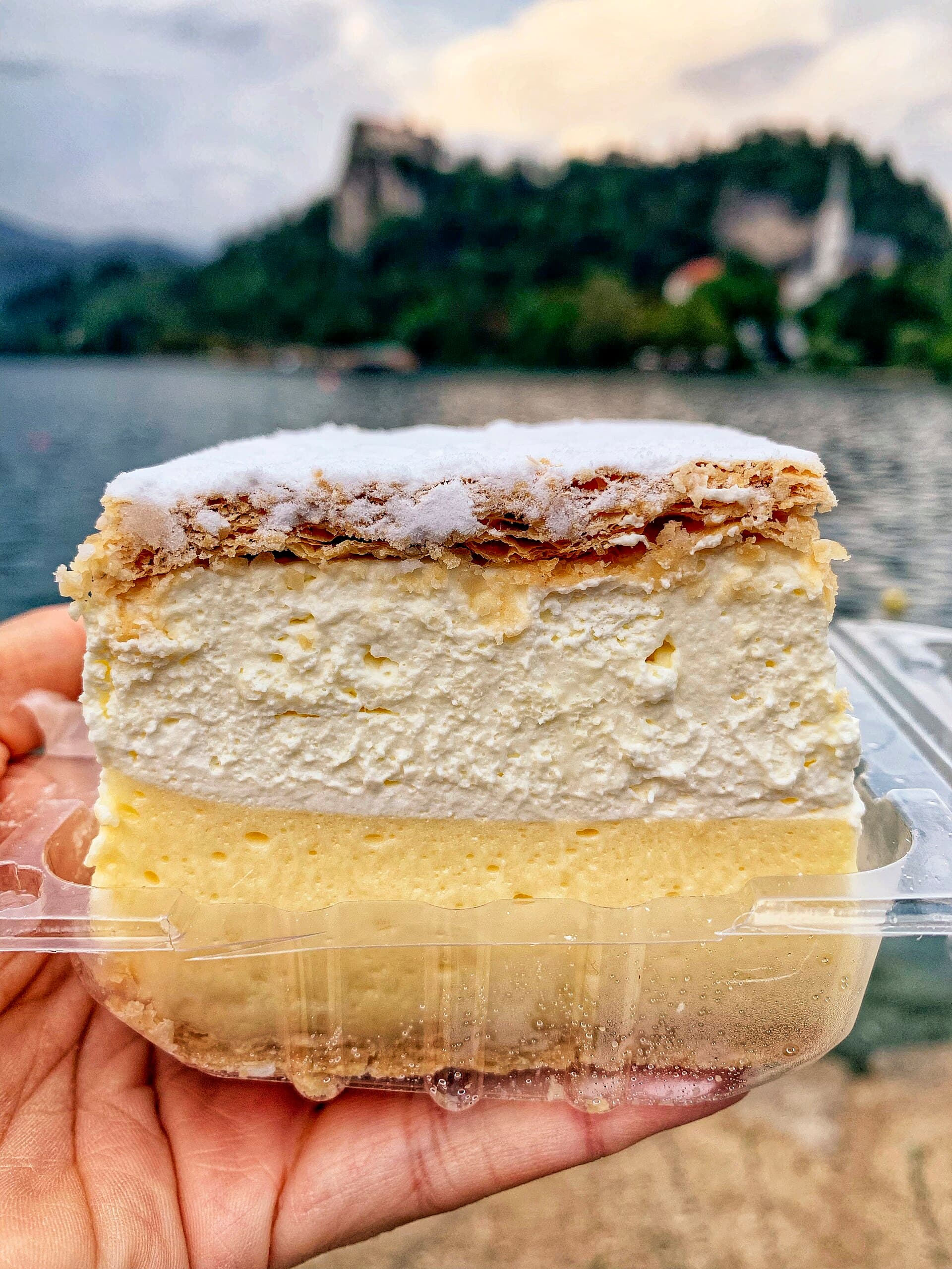 A slice of Bled cream cake with custard and whipped cream